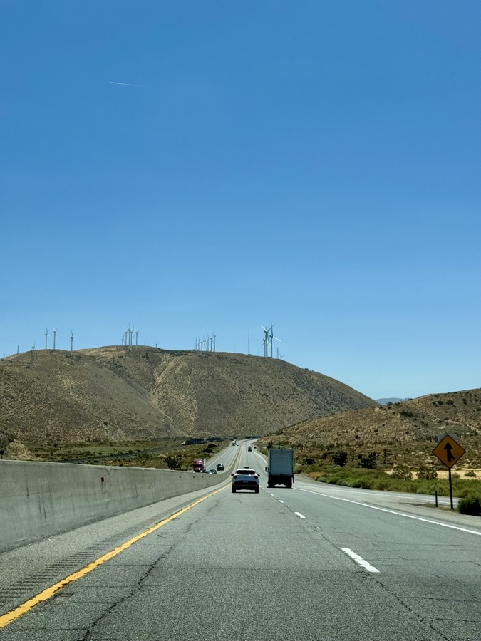 Photograph of CA-58 Road + Wind Turbine in Tehachapi, California — road trip view, July 22, 2026